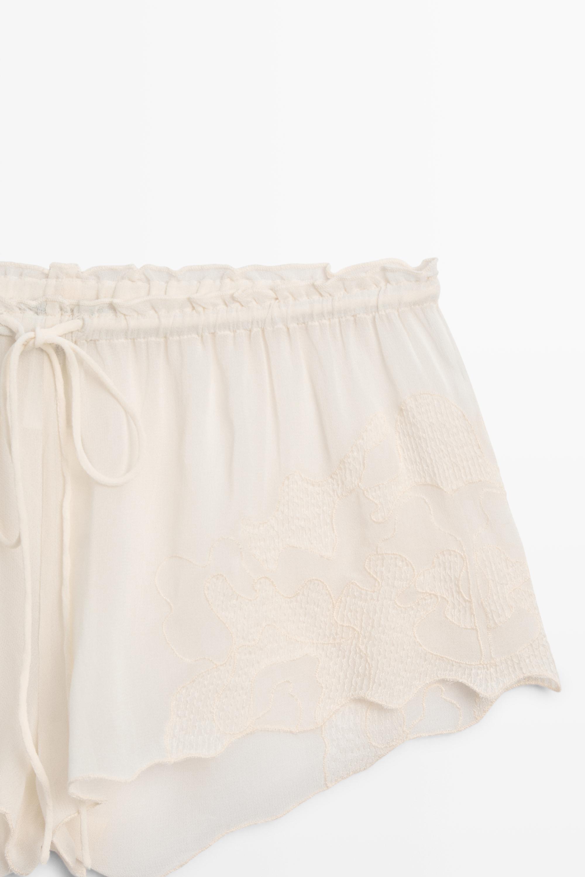 Flowing shorts with embroidered detail